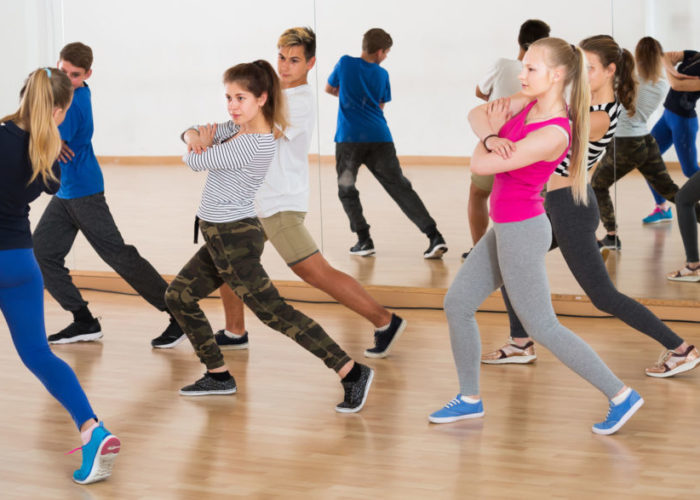 young students having dancing class